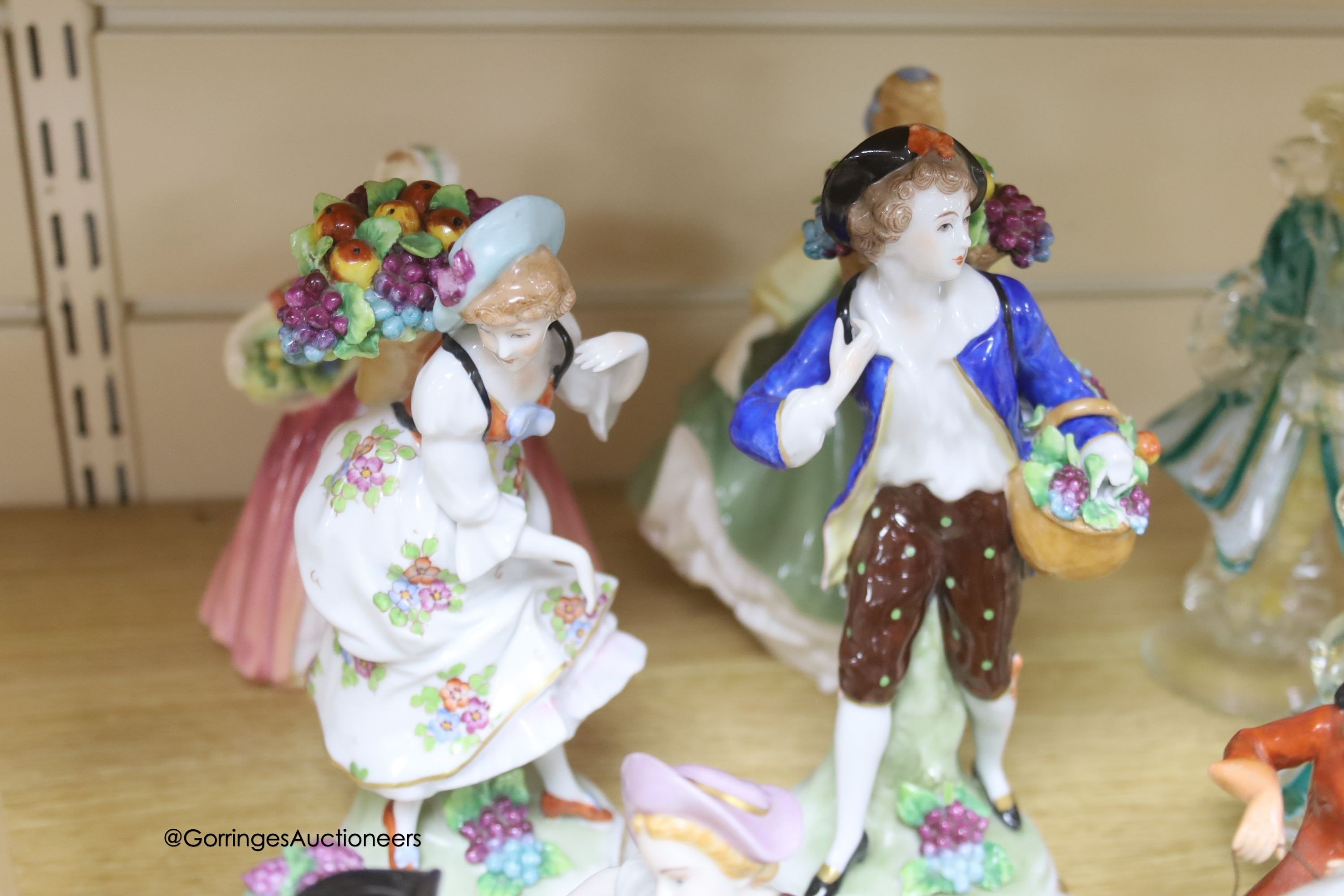 A collection of 20th century Sitzendorf, Dresden and Doulton porcelain figures, tallest 21cm and a pair of Murano glass figures